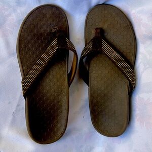 Brown and gold viconic flip flops